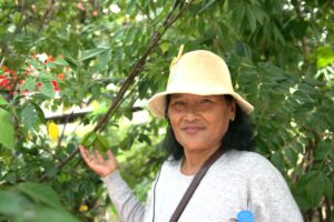 Woman farmer leader showing a starfruit in Cambodia